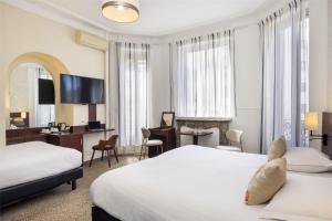 Postel nebo postele na pokoji v ubytování Best Western Plus Hôtel Brice Garden Nice