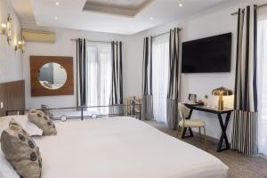Postel nebo postele na pokoji v ubytování Best Western Plus Hôtel Brice Garden Nice
