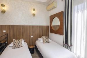 Postel nebo postele na pokoji v ubytování Best Western Plus Hôtel Brice Garden Nice