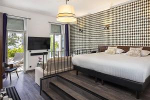 Postel nebo postele na pokoji v ubytování Best Western Plus Hôtel Brice Garden Nice