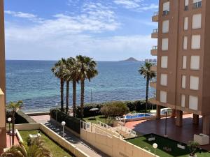 a view of the ocean from a building at Punta Cormoran by Alina365 in La Manga del Mar Menor