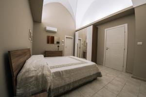 Ένα ή περισσότερα κρεβάτια σε δωμάτιο στο Casa vacanze Cittadella Nuova +10 φωτογραφίες