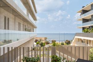a view of the beach from the balcony of a building at GuestReady - Bright & Inviting Stay in Vila Nova de Gaia