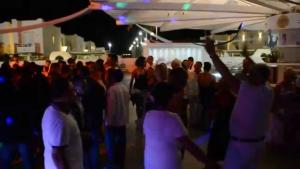 a group of people standing in a crowd at a party at Casa Aquatika Mediterranea Borgo Rio Favara in Ispica +17 photos