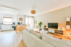 TV a/nebo společenská místnost v ubytování Le Rosslauf