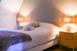 Postel nebo postele na pokoji v ubytování Le Rosslauf