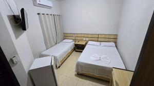 Postel nebo postele na pokoji v ubytování Alfa Hotel Nova Mutum