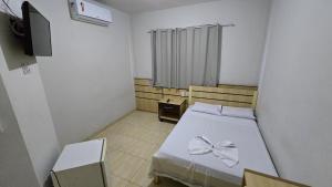 Postel nebo postele na pokoji v ubytování Alfa Hotel Nova Mutum
