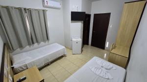 Postel nebo postele na pokoji v ubytování Alfa Hotel Nova Mutum