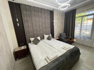 Voodi või voodid majutusasutuse Zangu Hotel toas