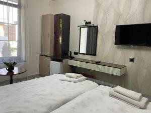 Voodi või voodid majutusasutuse Zangu Hotel toas