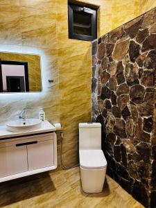 a bathroom with a toilet and a sink at Ler House Dilijan in Dilijan