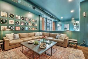 a living room with a couch and a table at Nashville Studio B Suite 4BR by Maddox Hotel in Nashville