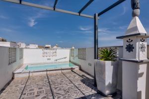 a view from the balcony of a house with a swimming pool at Patio Suite - by Enjoy your stay in Olhão