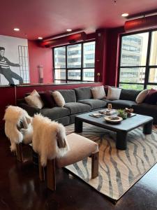 a living room with a couch and a table at Nashville Elvis Suite 4BR by Maddox Hotel in Nashville +40 photos