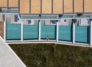 an overhead view of a building with a swimming pool at Poseidon Villas in Skiathos Town
