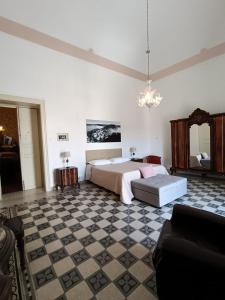 Postel nebo postele na pokoji v ubytování Residenza Donnafugata B&B