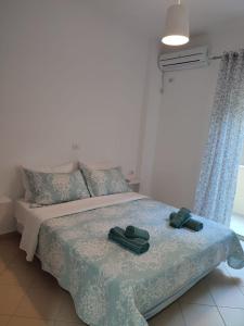 Postel nebo postele na pokoji v ubytování Luli Apartment