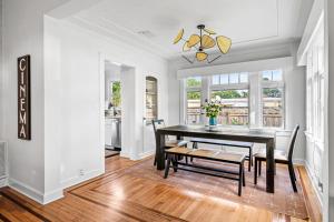 a dining room with a table and chairs at Poolside Getaway, Close To Dt Coastal Beach in West Palm Beach