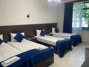 Voodi või voodid majutusasutuse Zangu Hotel toas