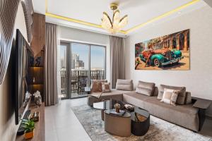 a living room with a couch and a car at Serene Haven Cozy Community Courtyard View in Dubai