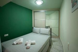 Ένα ή περισσότερα κρεβάτια σε δωμάτιο στο Kaitis home