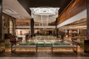 a pool in a hotel lobby with a chandelier at The Grand Hotel Sharm El Sheikh in Sharm El Sheikh +59 photos