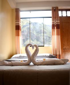 Postel nebo postele na pokoji v ubytování Hotel Everest