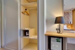 Cama ou camas em um quarto em Celeste Bella Luxury Hotel & Spa