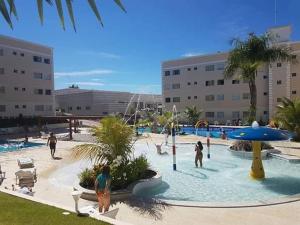 a group of people playing in a water park at Encontro das Águas Thermas Resort - Caldas Novas, Goiás in Caldas Novas