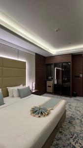 Postel nebo postele na pokoji v ubytování Dimond Vision Hotel