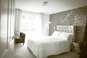 Ένα ή περισσότερα κρεβάτια σε δωμάτιο στο Florence Suites