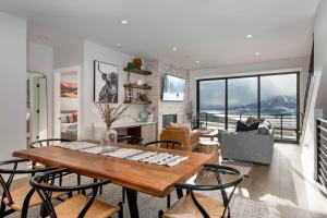 a living room with a wooden table and chairs at Klaim Retreats 807 in Park City