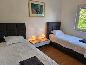 Posteľ alebo postele v izbe v ubytovaní Apartments Maček
