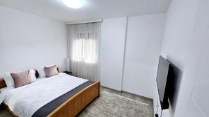 Postel nebo postele na pokoji v ubytování Apartman Car