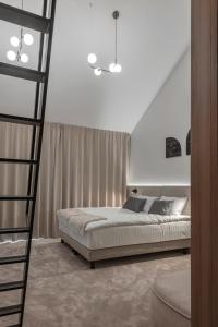 Postel nebo postele na pokoji v ubytování LAJOS Hotel