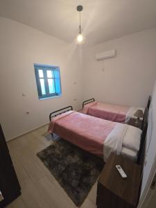Postel nebo postele na pokoji v ubytování Sugar Stone House