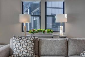 a living room with a couch and two lamps at Mayflower Village 991 in Heber City