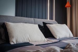 Łóżko lub łóżka w pokoju w obiekcie Apartament Family Green z garażem, klimatyzacją do 6 osób