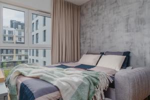 Łóżko lub łóżka w pokoju w obiekcie Apartament Family Green z garażem, klimatyzacją do 6 osób