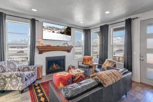 a living room with a couch and a tv at Coyote Ridge 1947 in Heber City