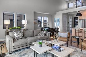 a living room with a couch and a table at Mayflower Village 991 in Heber City