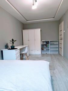 Katil atau katil-katil dalam bilik di APARTAMENT Przy Rynku