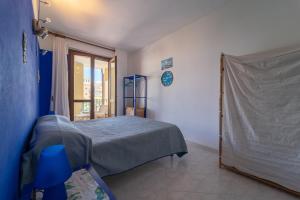 Postel nebo postele na pokoji v ubytování Villa Laconi