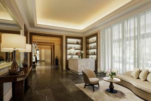 a living room with a couch and a table at The St. Regis Osaka in Osaka