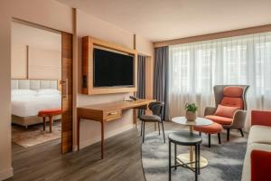 a hotel room with a bed and a desk at Vienna Marriott Hotel in Vienna