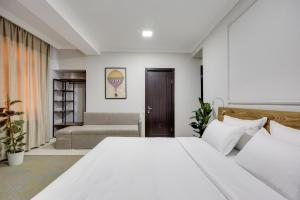 Letto o letti in una camera di Regraph Hotel
