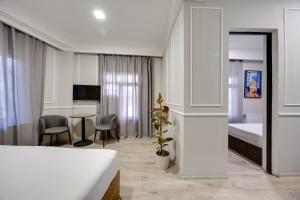 TV o dispositivi per l'intrattenimento presso Regraph Hotel