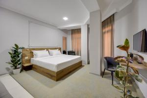 Letto o letti in una camera di Regraph Hotel