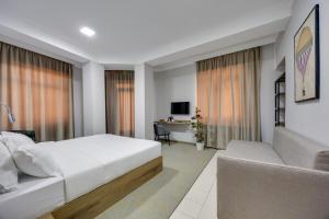 Letto o letti in una camera di Regraph Hotel